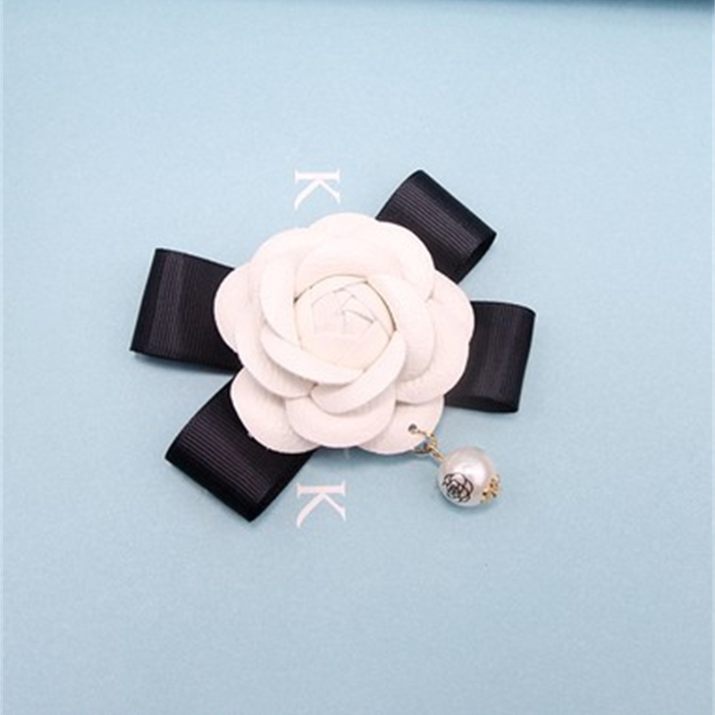 Camelia hecha a mano con lazo  - String Of Pearls Plant reseña y precio